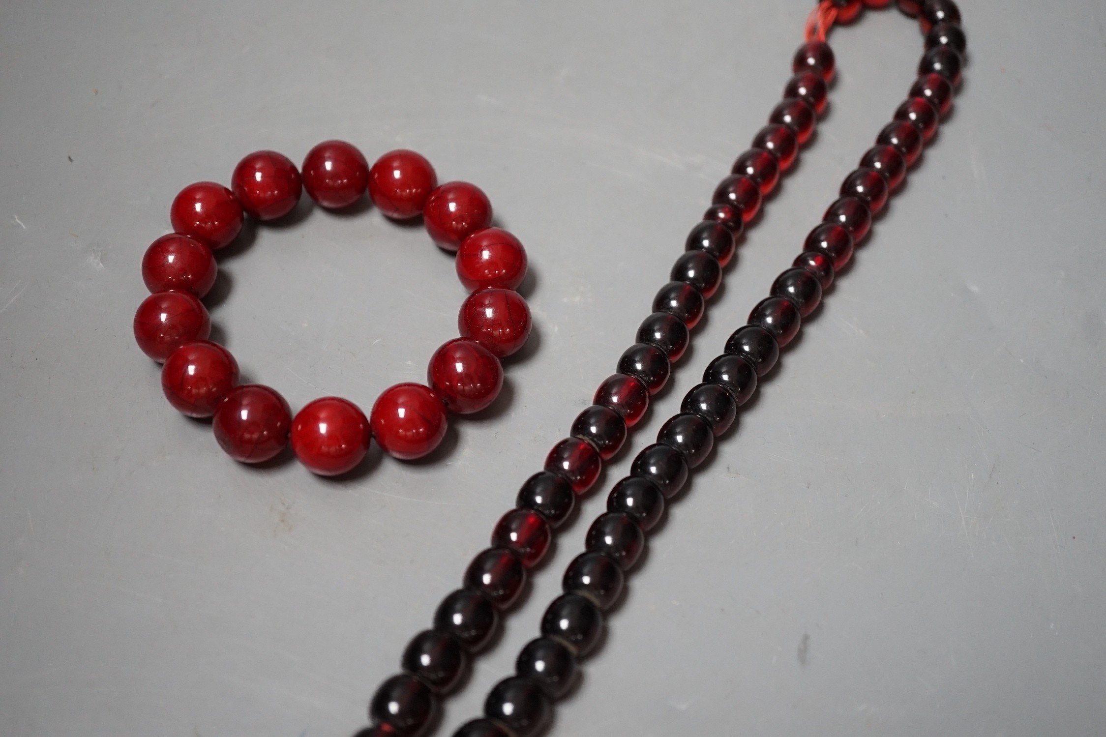 Two simulated Cherry Amber beads